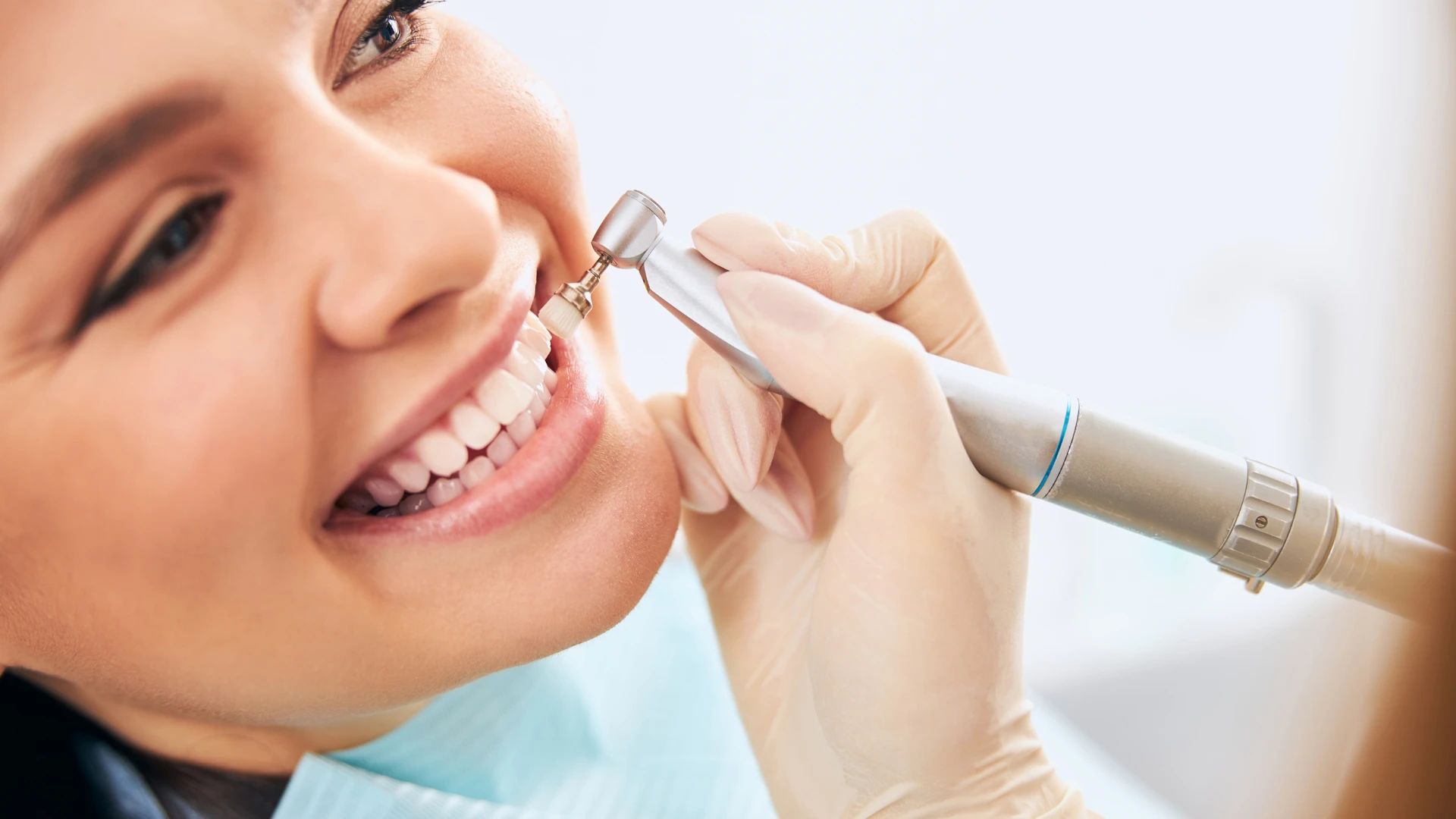 Female patient smiling during teeth whitening treatment